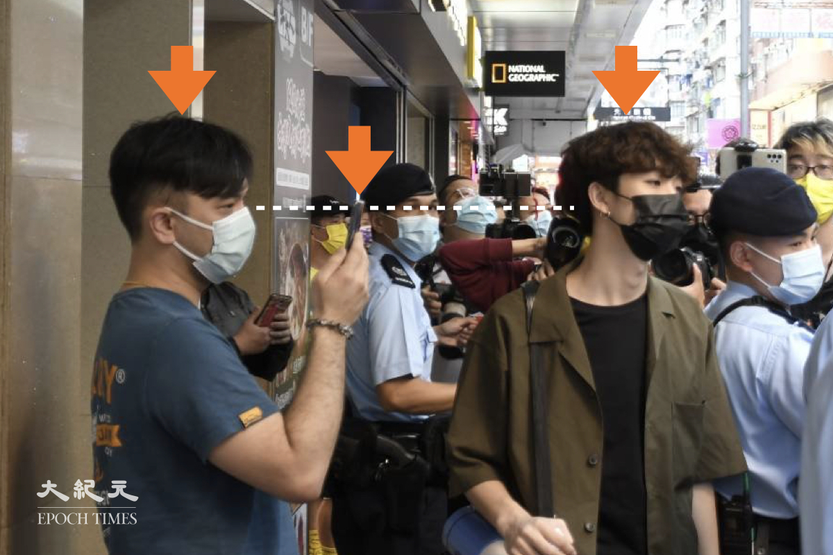 4月11日賢學思政召集人王逸戰在旺角呼籲市民給在囚良心犯寫生日卡，期間被疑似便衣人員以手機近距離拍攝。（麥碧/大紀元）