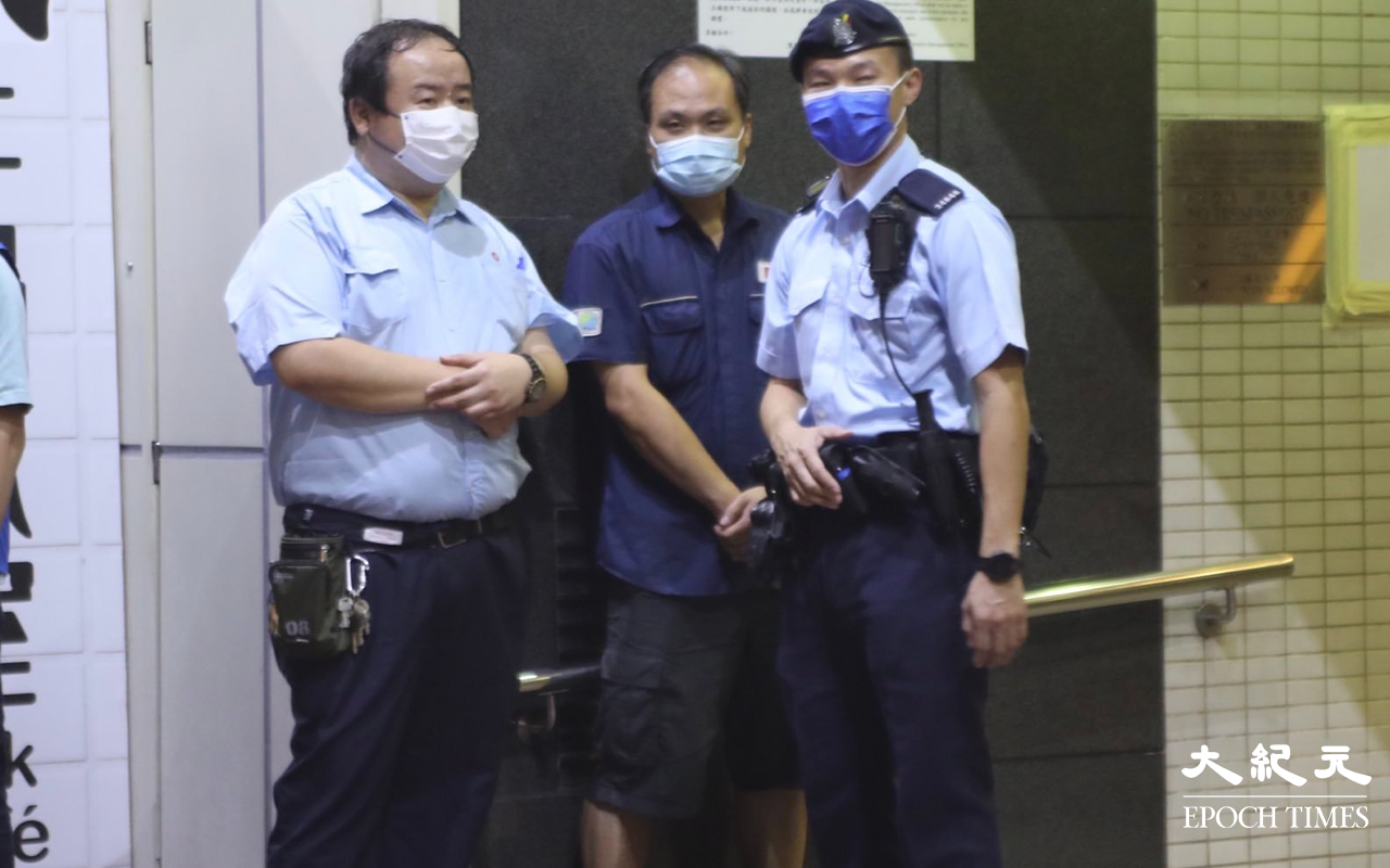 晚上7時，警方將荃灣寶石大廈第一座正式圍封，表示上述地方被列為受限區域。（琪／大紀元）