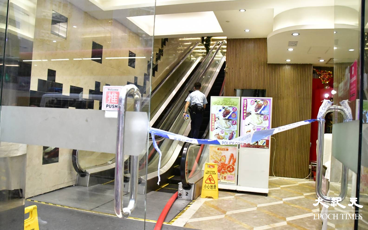 警方趕抵長沙灣道681號富臨海鮮酒家，隨即將現場拉起封鎖線封鎖。（麥碧／大紀元）